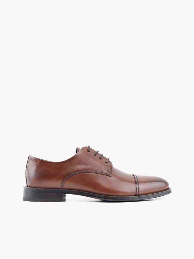 Sapatos de Pele