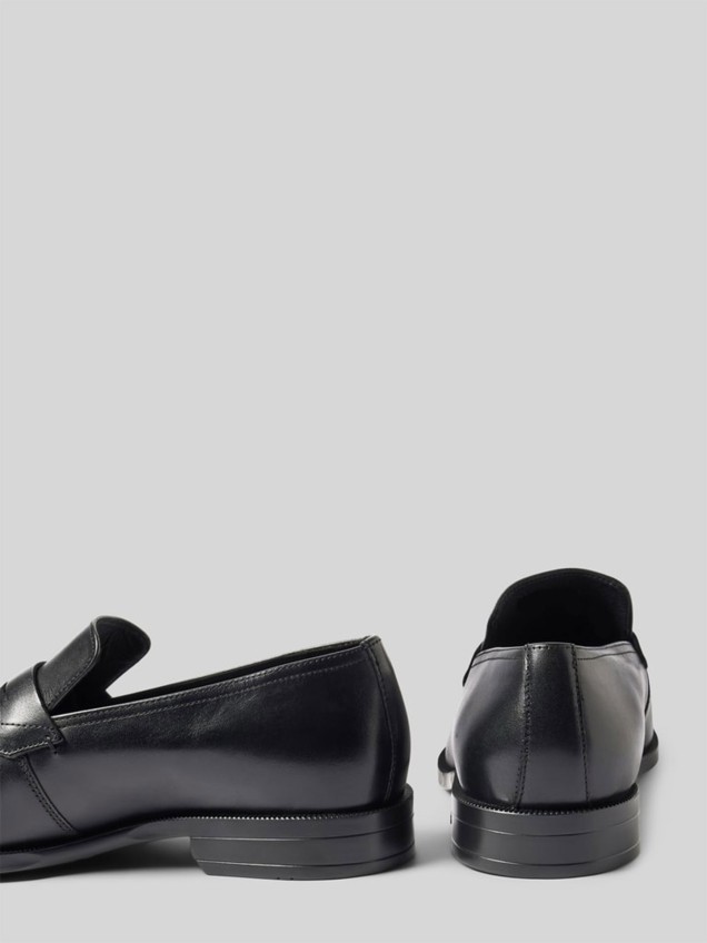Sapatos de Pele
